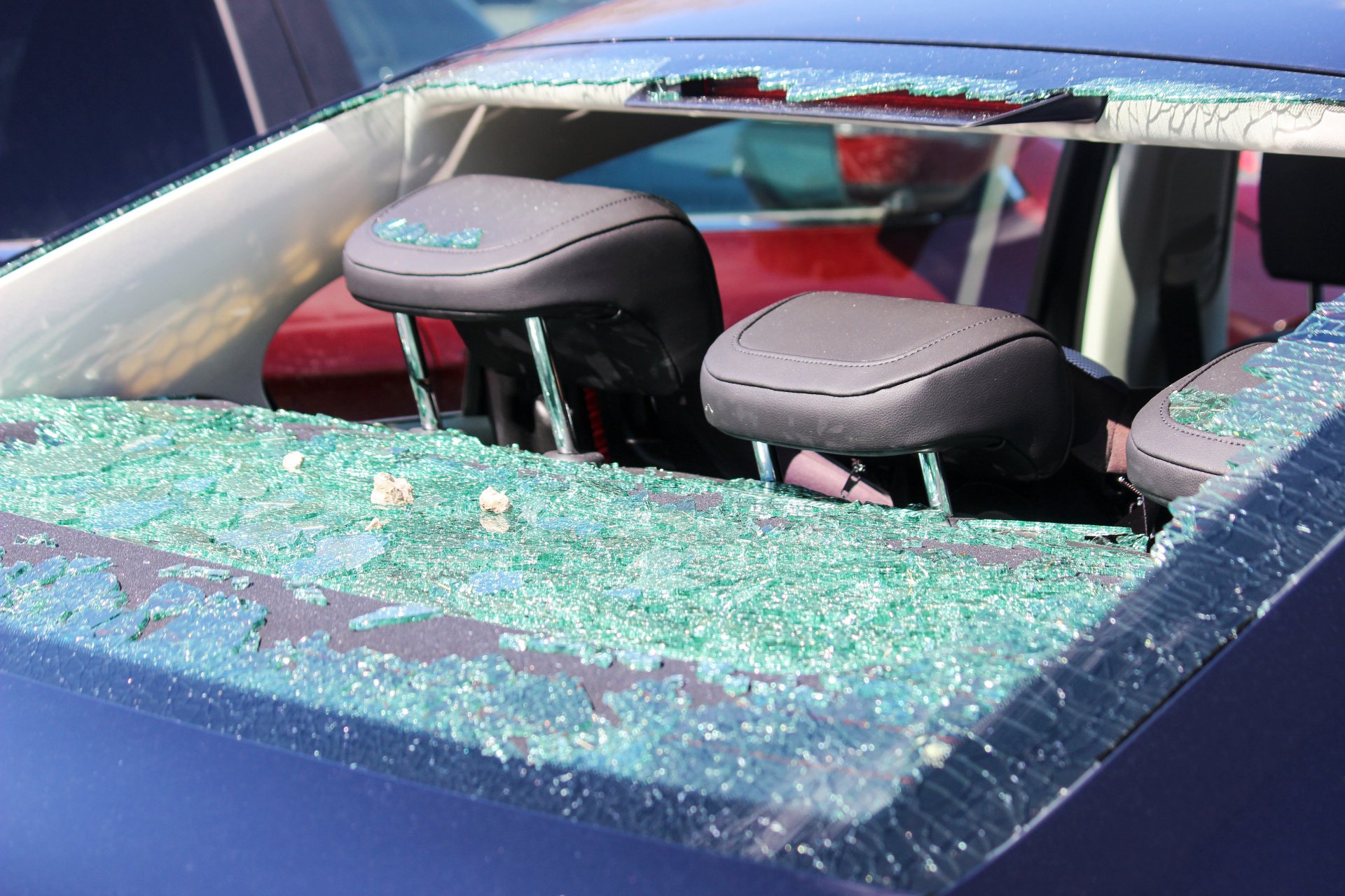 Auto back glass replacement being completed by a technician